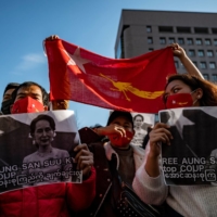 A group of Myanmar activists protest outside the United Nations University building in Tokyo on Monday after Myanmar\'s military seized power in a coup. | AFP-JIJI